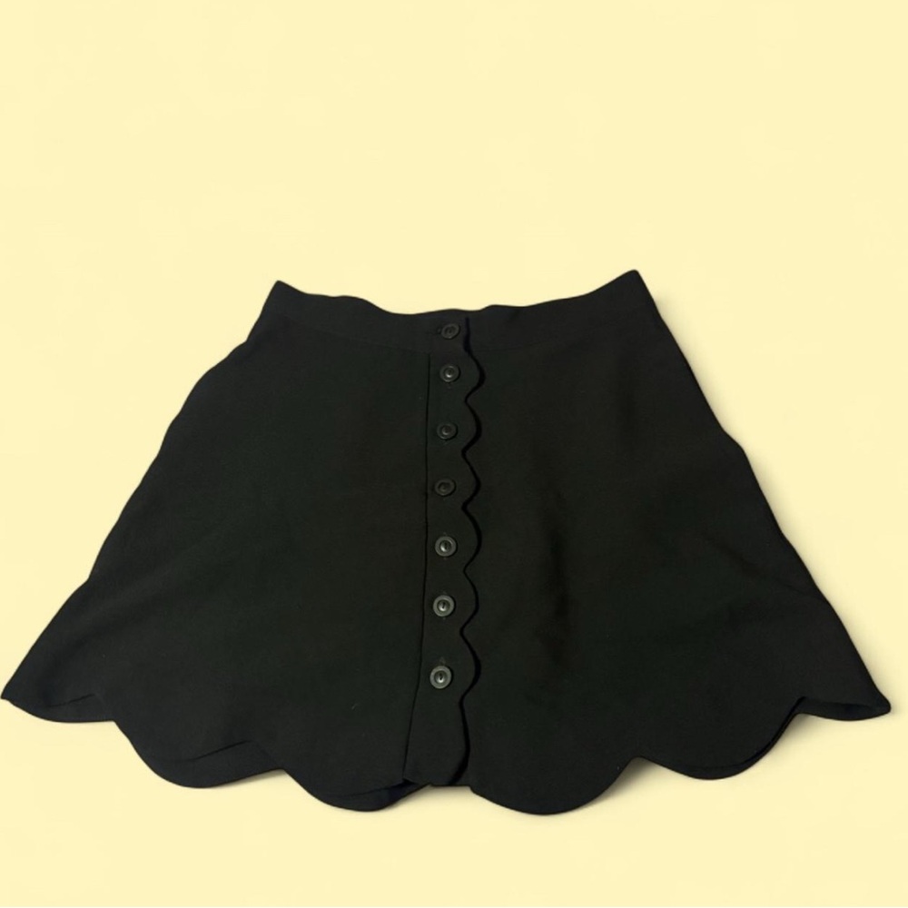 Black scalloped button-front mini skirt